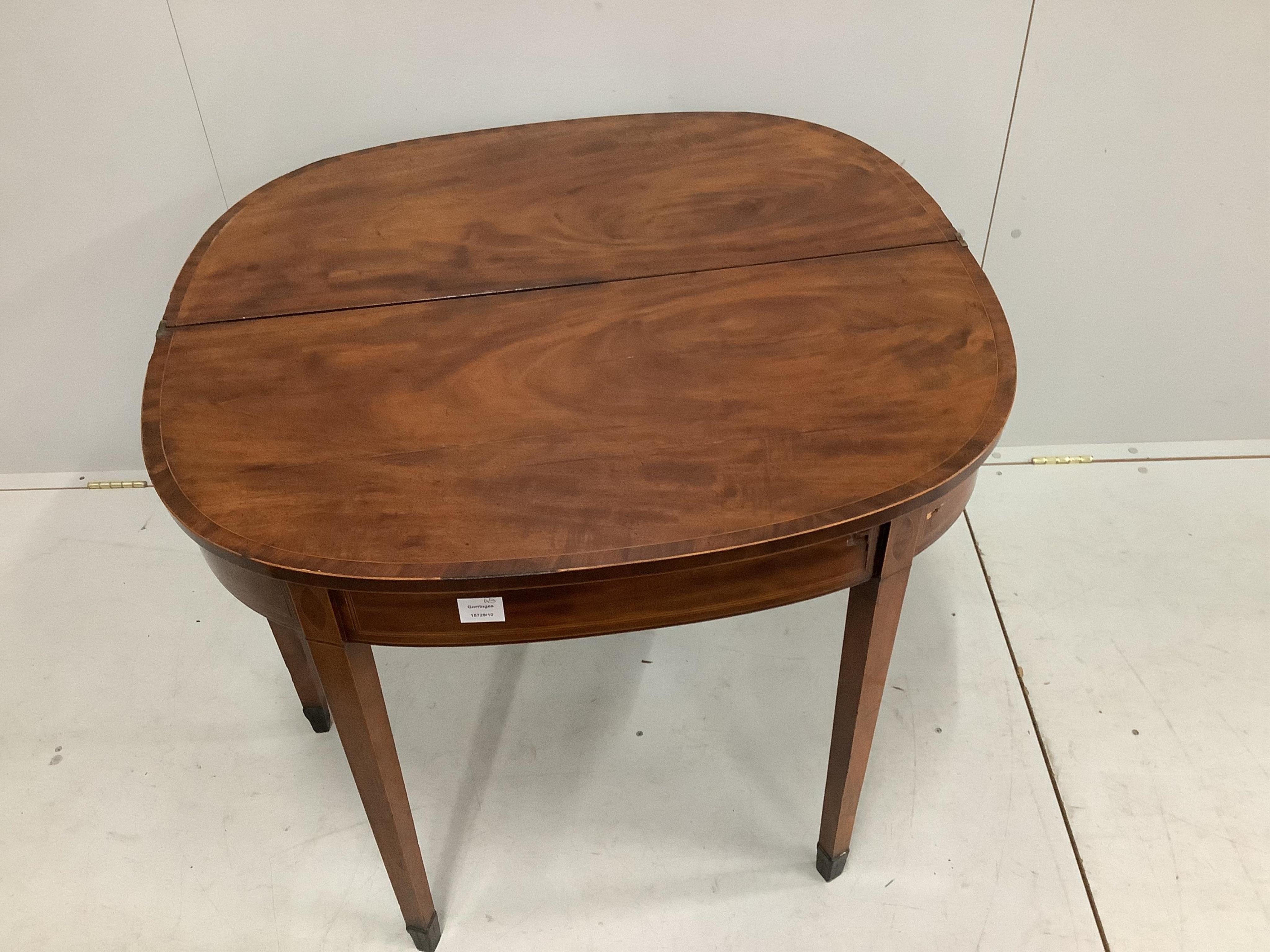 A George III inlaid mahogany tea table, width 92cm. Condition - poor